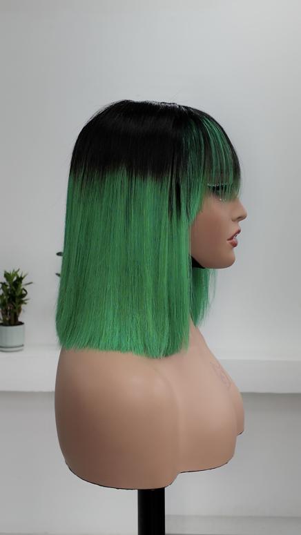 Side view of Worry Freeshop black root green ombre straight bob wig with bangs