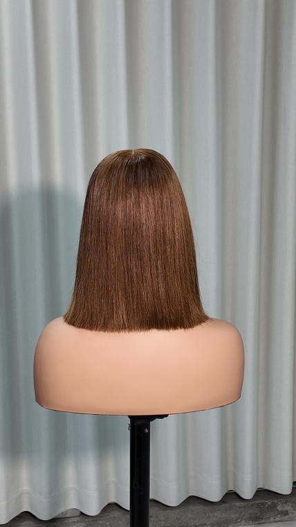 Back view of Worry Freeshop 10 inch brown bob with blonde front highlight human hair wig