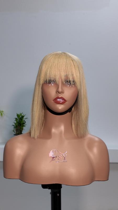 Front view of Worry Freeshop 10 inch honey blonde bob human hair wig with bangs