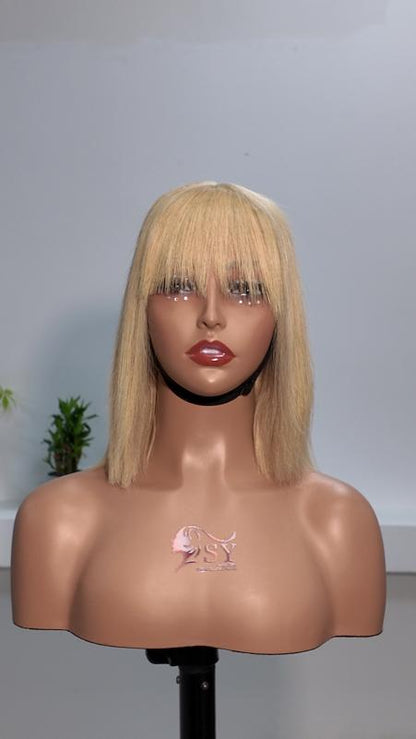 Front view of Worry Freeshop 10 inch honey blonde bob human hair wig with bangs