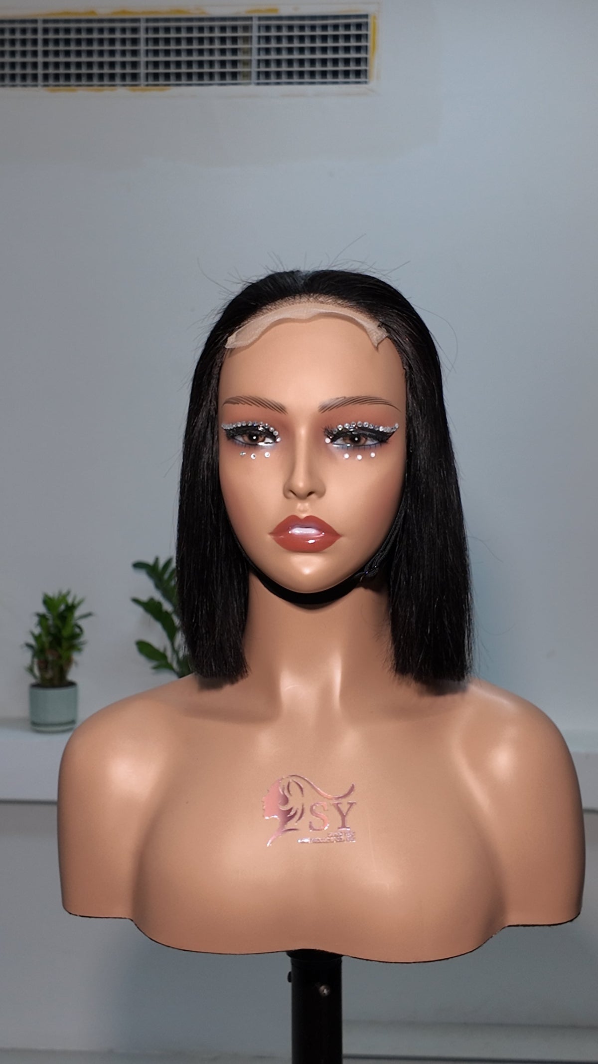 Front view of Worry Freeshop 10 inch lace front straight bob human hair wig in natural black