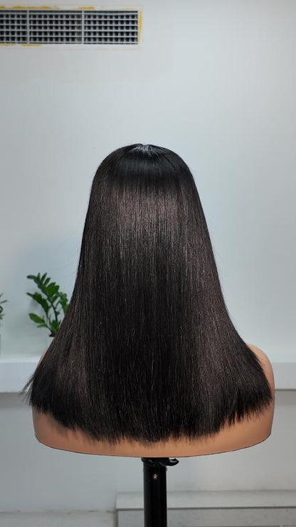 Back view of Worry Freeshop 14 inch natural black straight human hair wig with bangs