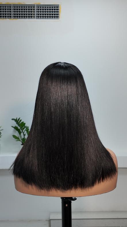 Back view of Worry Freeshop 14 inch natural black straight human hair wig with bangs
