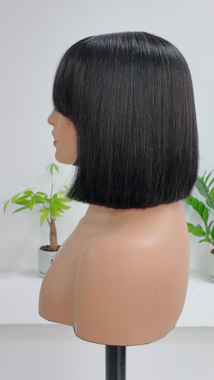 Side view of Worry Freeshop natural black straight bob human hair wig with bangs