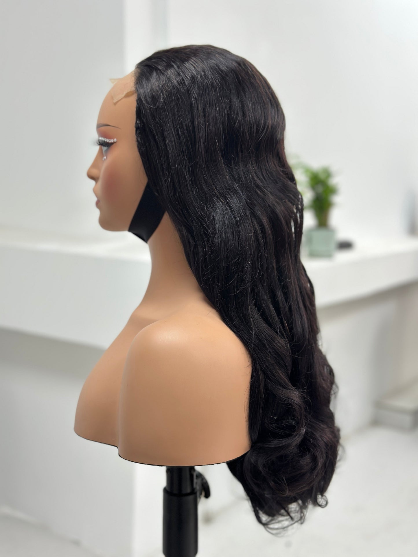 Side view of Worry Freeshop 24 inch natural black loose wave human hair wig