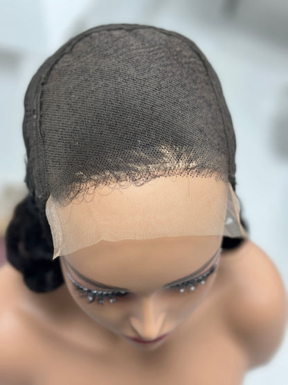 Lace and cap construction of natural black loose curl human hair wig