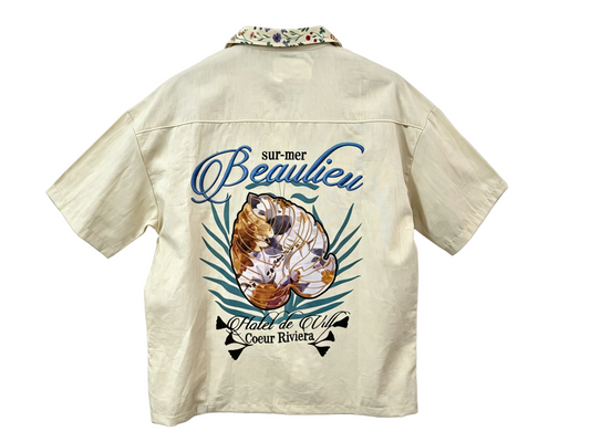 Beige resort print short sleeve button-up shirt with large back graphic for wholesale clothing buyers