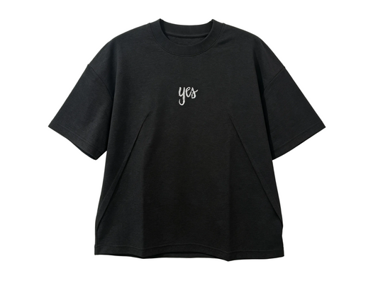 Black relaxed-fit T-shirt with white yes embroidery and angled front panel seams