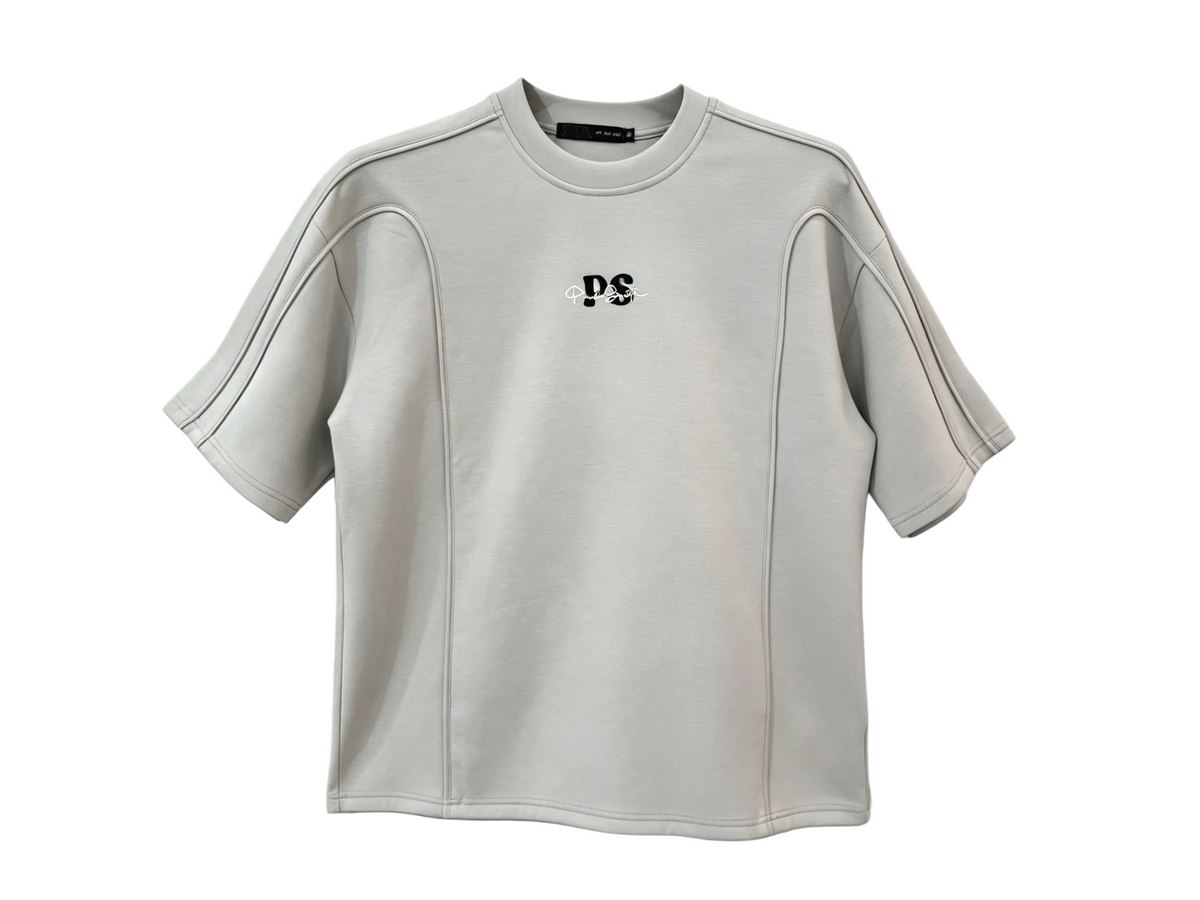 Light gray relaxed-fit T-shirt with raised piping and curved panel seams