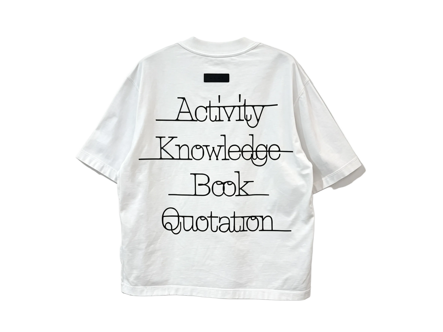 White relaxed-fit T-shirt with oversized black typography print on the back